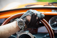 Retro driving gloves and modded Seiko SKX031, suitable for vintage motoring.